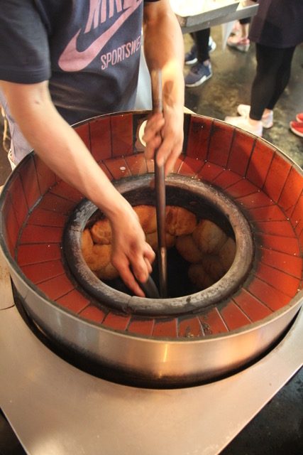 Taiwan street food: Black pepper buns in the oven at Raohe Night Market, Taipei, Taiwan